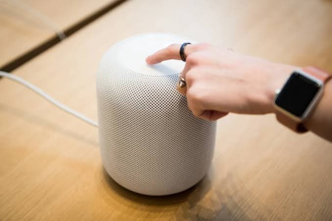 Reporting from Bloomberg's Mark Gurman, picked up by GSMArena and CNET, describes a ChatGPT-powered home speaker with moving mechanical parts, a camera, and personality-driven design — built with Jony Ive's team and slated to launch in 2027.
